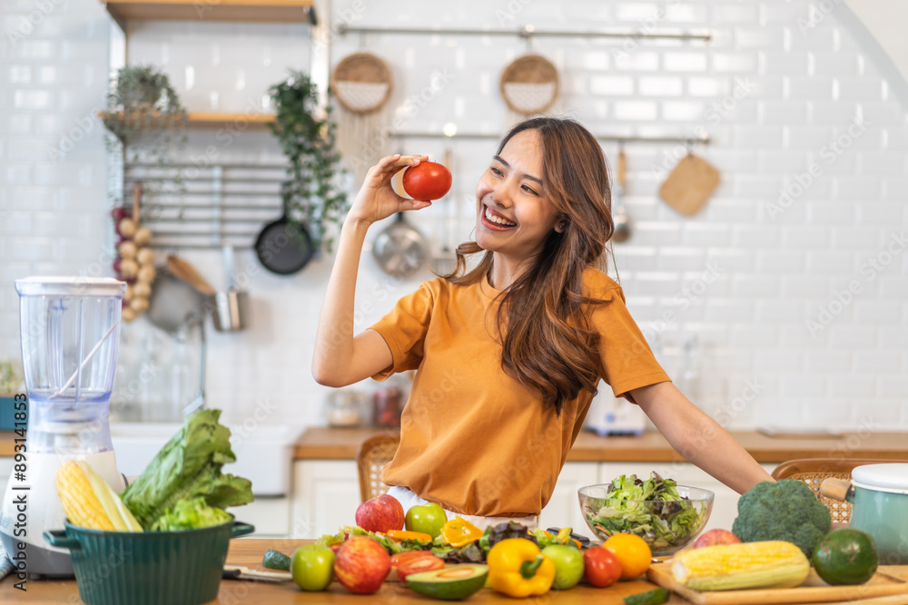 Portrait of beauty health asian woman having fun hold tomato cooking, vegan food healthy eat, fresh vegetable, Lycopene, vitamins, skincare, vegetarian in kitchen.Diet.Fitness, healthy food Portrait of beauty health asian woman having fun hold tomato cooking, vegan food healthy eat, fresh vegetable, Lycopene, vitamins, skincare, vegetarian in kitchen.Diet.Fitness, healthy food