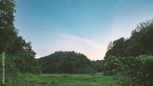 Sunset of a rural landscape in Japan captured in time lapse.