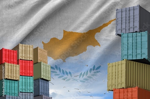 Cyprus flag and big stack of shipping cargo containers in docks with sky background close up photo