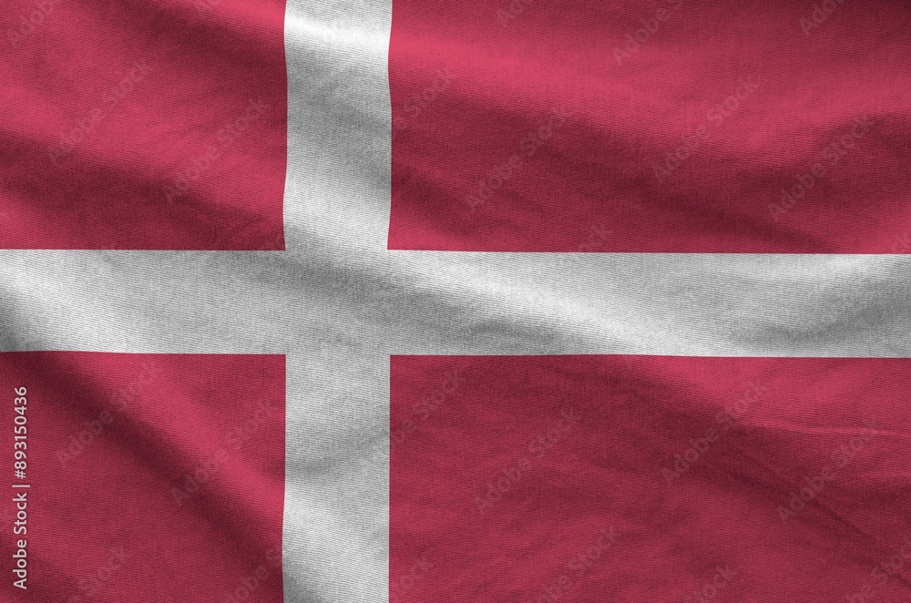 Denmark flag depicted on folded wavy fabric of old cloth close up Denmark flag depicted on folded wavy fabric of old cloth close up