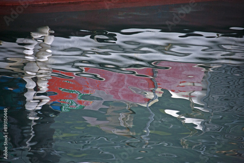 High angle view of ripple and fishing boat reflection on water at Nogu Breakwater of Songjeong-ri near Namhae-gun, South Korea
 photo