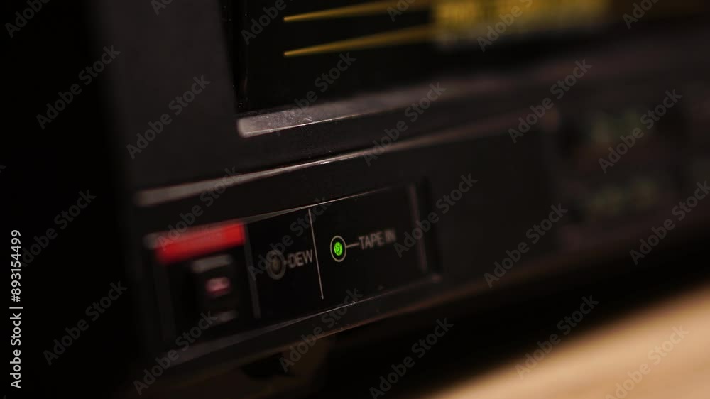 Tape In Signal Light on VCR Turning on When VHS Video Cassette Tape is Inserted, Close Up Tape In Signal Light on VCR Turning on When VHS Video Cassette Tape is Inserted, Close Up
