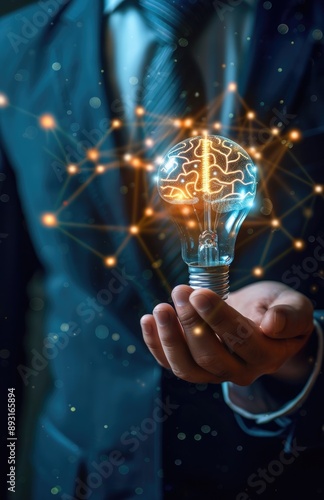 Wallpaper Mural A Hand Holding a Lightbulb Shaped as a Brain Torontodigital.ca