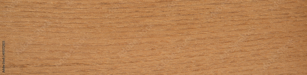 Naklejka premium Smooth acacia veneer with fine wood grain and warm honey shades