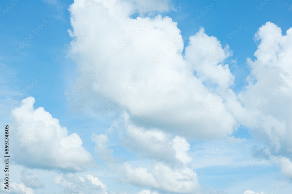 Spectacular soft white cumulus clouds move in the blue sky. Background of clouds changing shape, moving in different directions at different heights, natural background. Spectacular soft white cumulus clouds move in the blue sky. Background of clouds changing shape, moving in different directions at different heights, natural background.