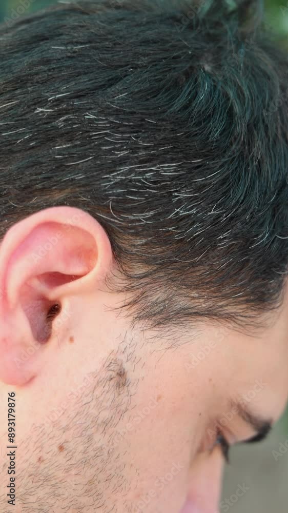 close up of man young male face profile, showing gray hair threads.getting old process. close up of man young male face profile, showing gray hair threads.getting old process.