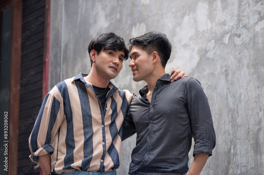 Portraits of happy Asian gay couple hugging and embracing