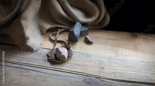 Tableau sur toile An antique leather sling lies on wooden desk