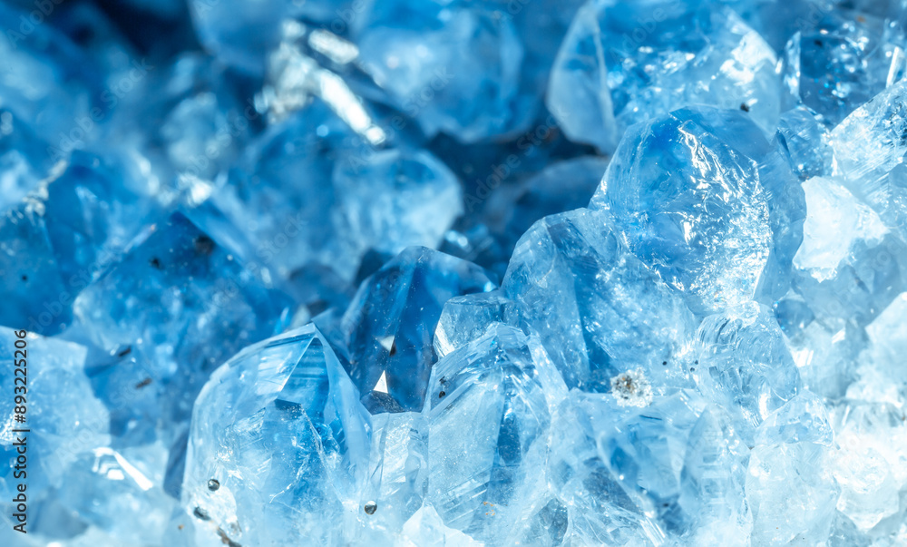 Blue Crystal Mineral Stone. Gems. Mineral crystals in the natural environment. Texture of precious and semiprecious stones. Seamless background with copy space colored shiny surface of precious stones Blue Crystal Mineral Stone. Gems. Mineral crystals in the natural environment. Texture of precious and semiprecious stones. Seamless background with copy space colored shiny surface of precious stones