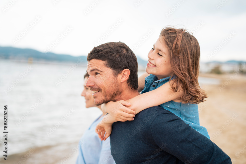 Happy father giving piggyback ride to daughter Happy father giving piggyback ride to daughter