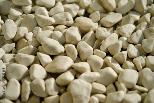 Close-up video of white stones. The pebbles are a light grey-beige ivory color. Pale natural colors, minimal background. Eco-friendly, ecological lifestyle, eco cosmetics advertising concept