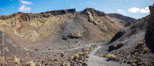 Spain, Canary Islands, Footpath winding along volcanic landscape of Volcan del Cuervo photo