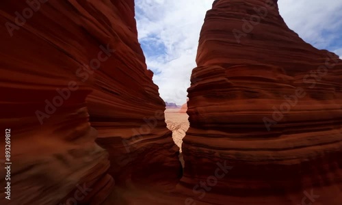 Majestic red rock formations stand tall in the dramatic desert landscape of Moab. 4K video.