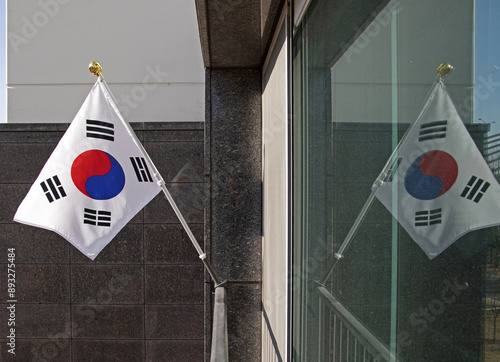 Close up of a Taegeukgi(Korean Flag) and flagpole on the veranda of a house, South Korea
 photo