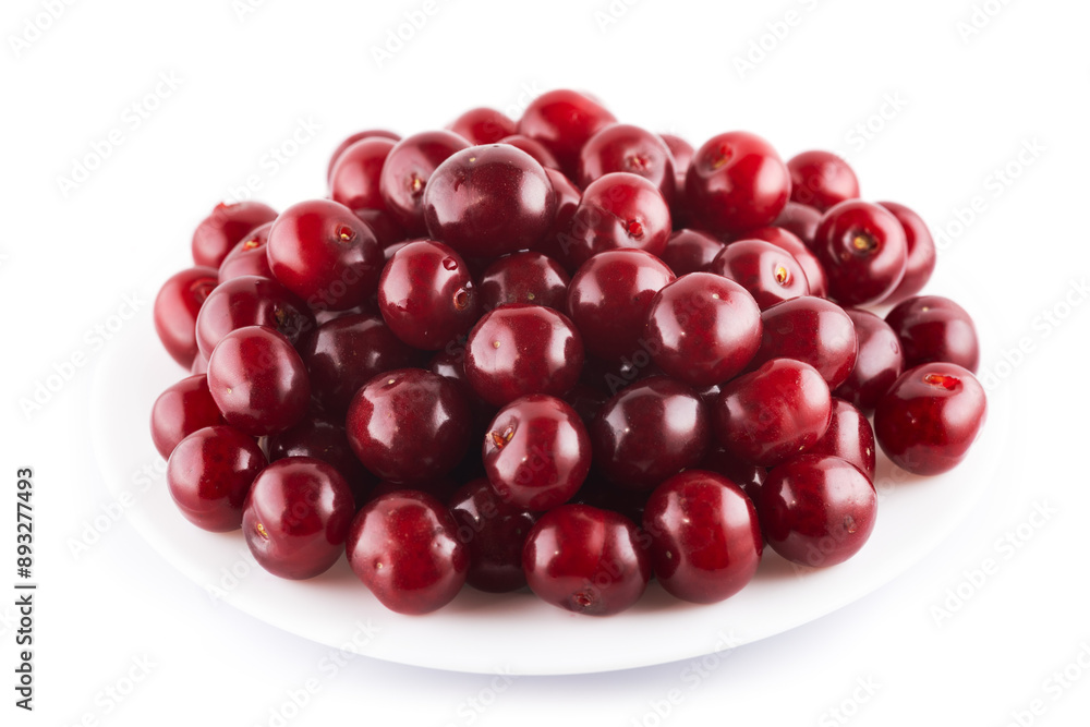 Ripe red cherries on plate isolated on white background Ripe red cherries on plate isolated on white background