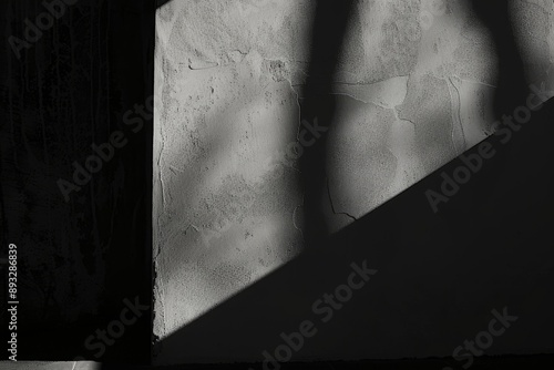 Shadow and Light Play on Concrete Wall photo