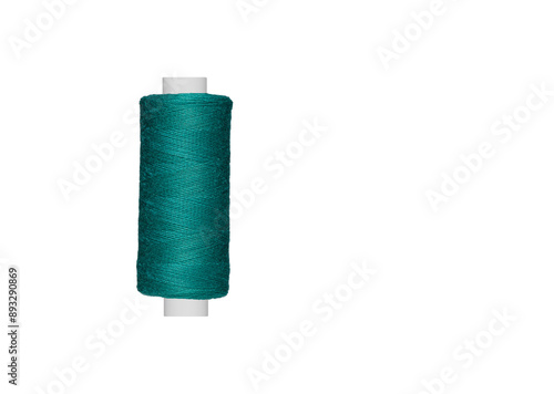 Fotografía blue spool of sewing thread isolated on white background close up