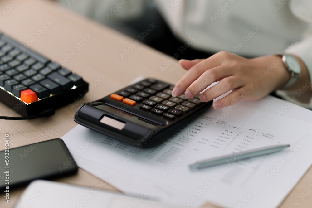 Businesswoman working with data spreadsheet documents at workplace Businesswoman working with data spreadsheet documents at workplace