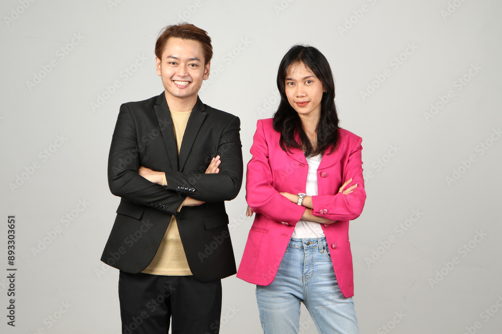 Portrait of successful business asian couple in suit with arms crossed and smile on isolated background Portrait of successful business asian couple in suit with arms crossed and smile on isolated background