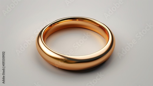 The minimalistic background emphasizes the simplicity and elegance of the gold ring. photo