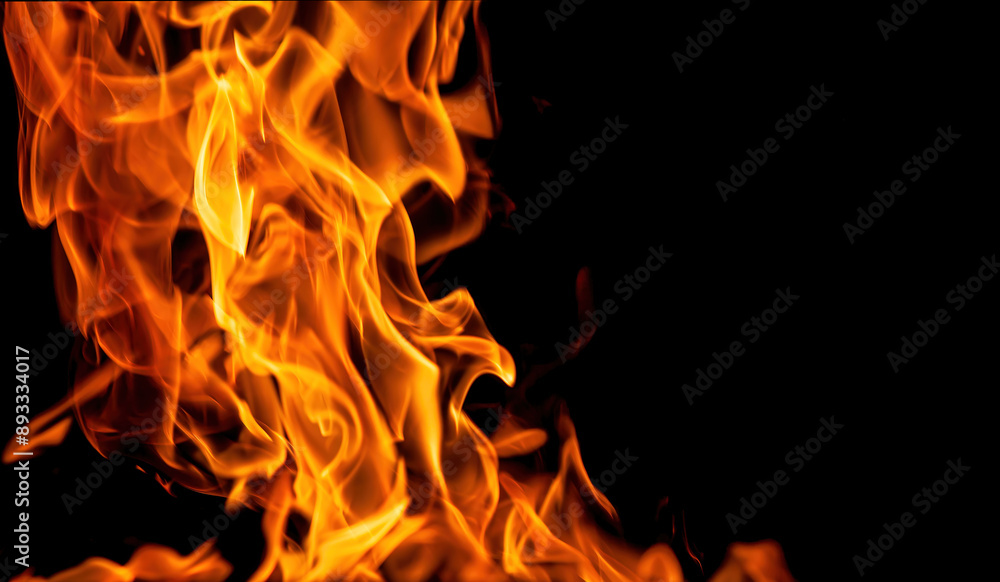 Orange fire flames on a black background Orange fire flames on a black background