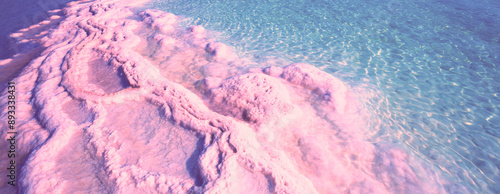 Texture of the Dead Sea in the pink light of the sunrise. Salty seashore. Abstract nature background