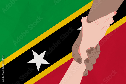 Helping hand against the Saint Kitts and Nevis flag. The concept of support. Two hands taking each other. A helping hand for those injured in the fighting, lend a hand photo