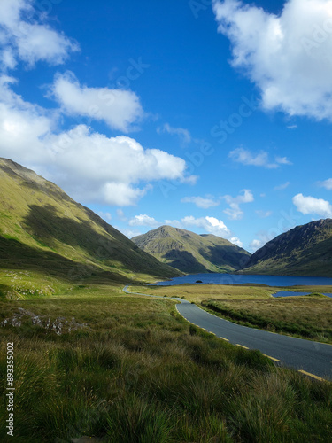 lake with road in the mountains 