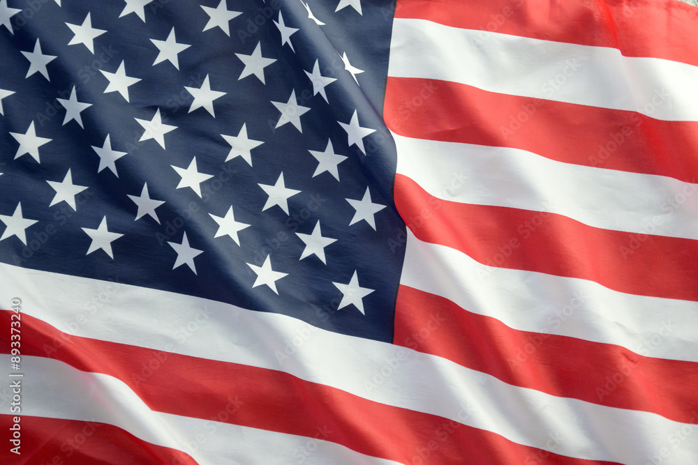 Fototapeta premium United States of America flag with stars and stripes close up. Official US Banner waving with folds