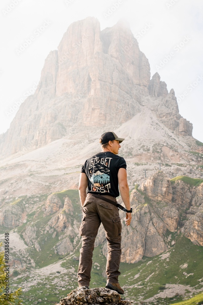 Naklejka premium adventures guys, pirates lost in the mountains with magnificent landscape. Mountains covered in clouds. Explorers having fun