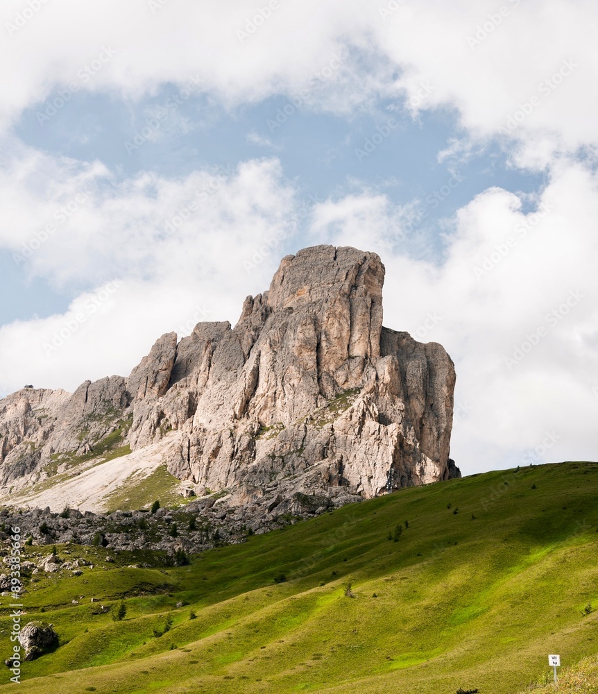 Obraz premium Landscapes of epic mountains during the sunset surrounded by clouds, with warm and cold lights. huge cliffs and epic views from the wild nature. 