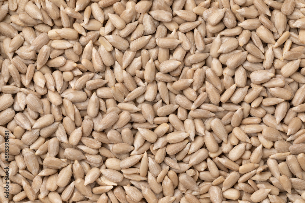 Shelled sunflower seeds close up full frame as background Shelled sunflower seeds close up full frame as background