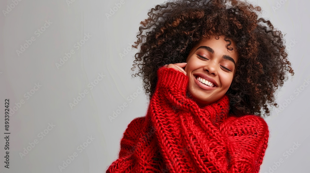 Woman in red sweater. Stay cozy and radiant with this stunning smile