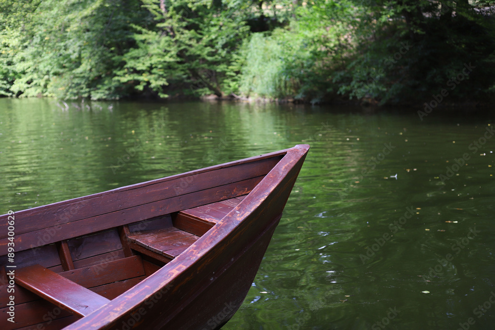 bow of a brown wooden boat against the background of the river bow of a brown wooden boat against the background of the river
