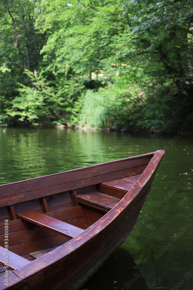 bow of a brown wooden boat against the background of the river bow of a brown wooden boat against the background of the river