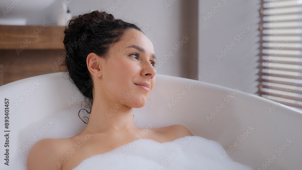 Close-up young attractive relaxed woman lying in hot foam bath with eyes closed resting relaxing in bathroom happy carefree pensive dreamy girl enjoying daily hygiene routine bathing washes bodycare Close-up young attractive relaxed woman lying in hot foam bath with eyes closed resting relaxing in bathroom happy carefree pensive dreamy girl enjoying daily hygiene routine bathing washes bodycare