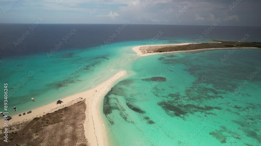 Cayo de agua in los roques with turquoise waters and sandy isthmus, aerial view Cayo de agua in los roques with turquoise waters and sandy isthmus, aerial view