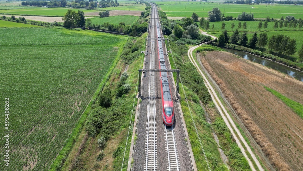 Fototapeta premium Europe, Italy , Milan - Frecciarossa Hight speed 300km h train railway from Milan to Rome view from the drone - the faster way to travel in Italy for tourist and passengers - tourist destination 