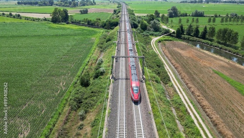 Europe, Italy , Milan - Frecciarossa Hight speed 300km h train railway from Milan  to Rome view from the drone - the faster way to travel in Italy for tourist and passengers - tourist destination 