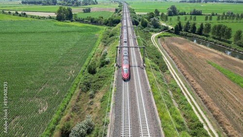 Europe, Italy , Milan - Frecciarossa Hight speed 300km h train railway from Milan  to Rome view from the drone - the faster way to travel in Italy for tourist and passengers - tourist destination 