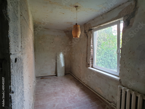 bathroom renovation, bathroom under renovation, toilet under renovation, peeling walls, crumbling plaster, unpainted walls, black key renovation, window, terrible old house, old German house, renovati photo