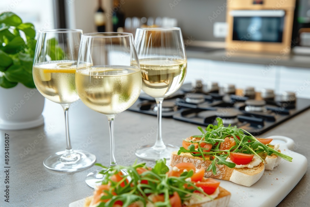 Modern Kitchen with Glasses of White Wine and Appetizers Modern Kitchen with Glasses of White Wine and Appetizers