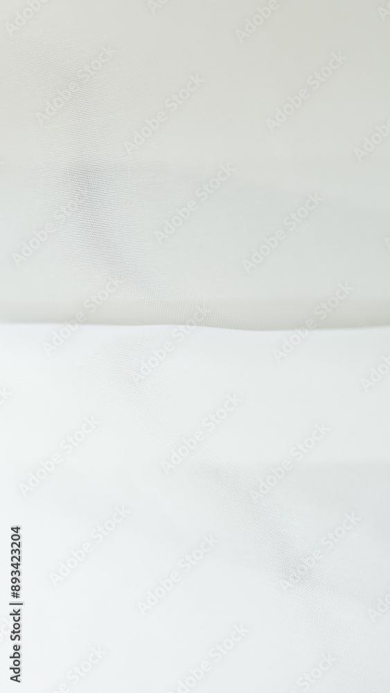 Fototapeta premium Elegant white tulle background for home textiles and wedding dress fabric
