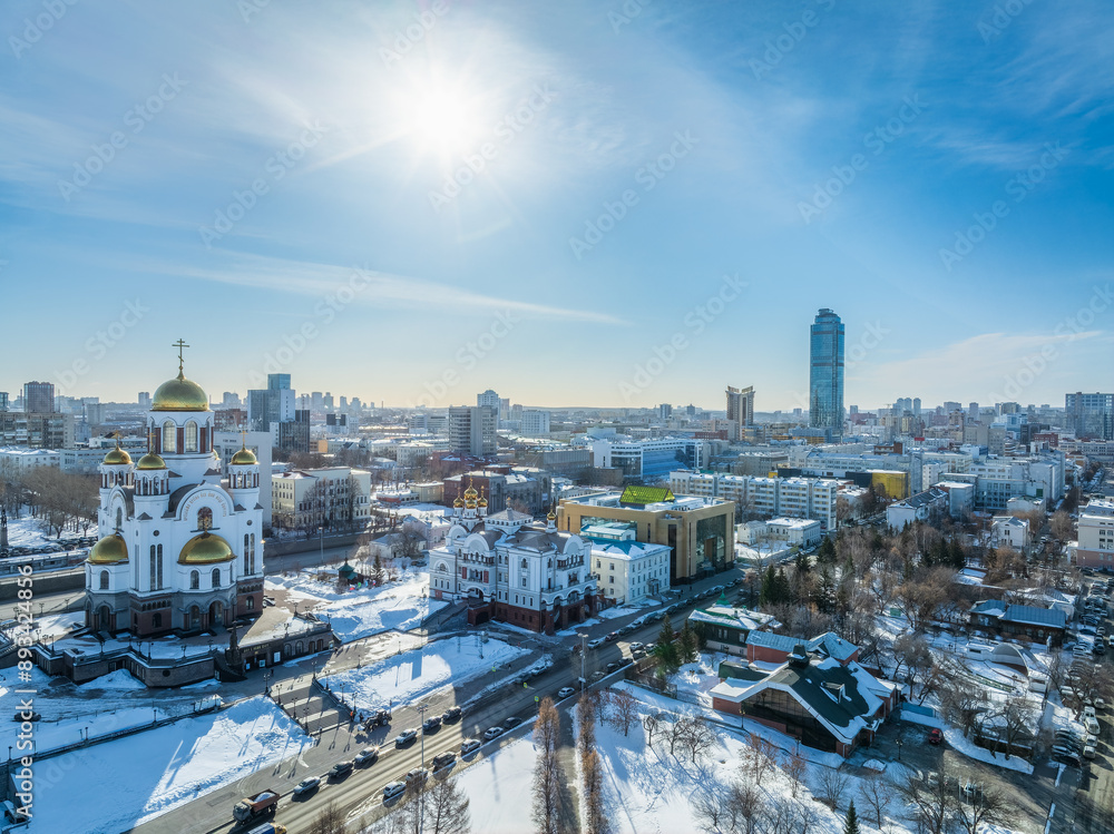 Naklejka premium Winter Yekaterinburg and Temple on Blood in beautiful cloudy sunset. Aerial view of Yekaterinburg, Russia. Translation of the text on the temple: Honest to the Lord is the death of His saints.