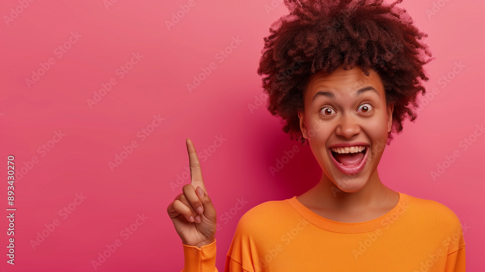 Portrait of a young woman pointing her fingers isolated on a pastel background.