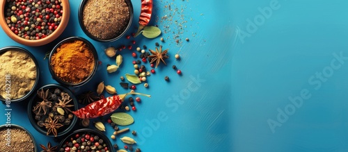 Spices arranged on a blue b...