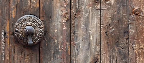 An aged metal doorknob on a...