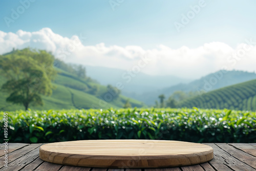 Wooden podium with blurred green tea fields and hazy sky