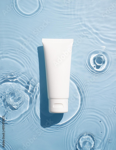 Obraz na płótnie White cosmetic tube gracefully floating on rippled water. Beauty and skincare product promotion w salonie