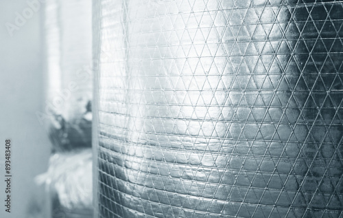 Aluminium foil insulation roll pattern background.
